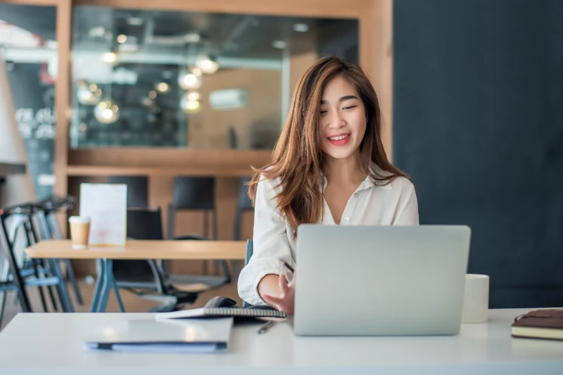 Charming asian businesswoman sitting and working