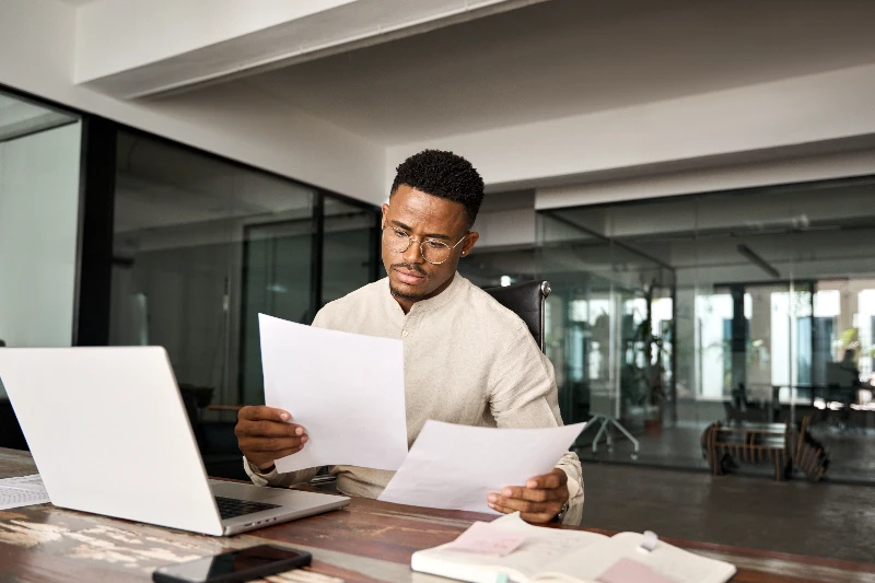 Blog 6 Underwriter reviewing loan docs